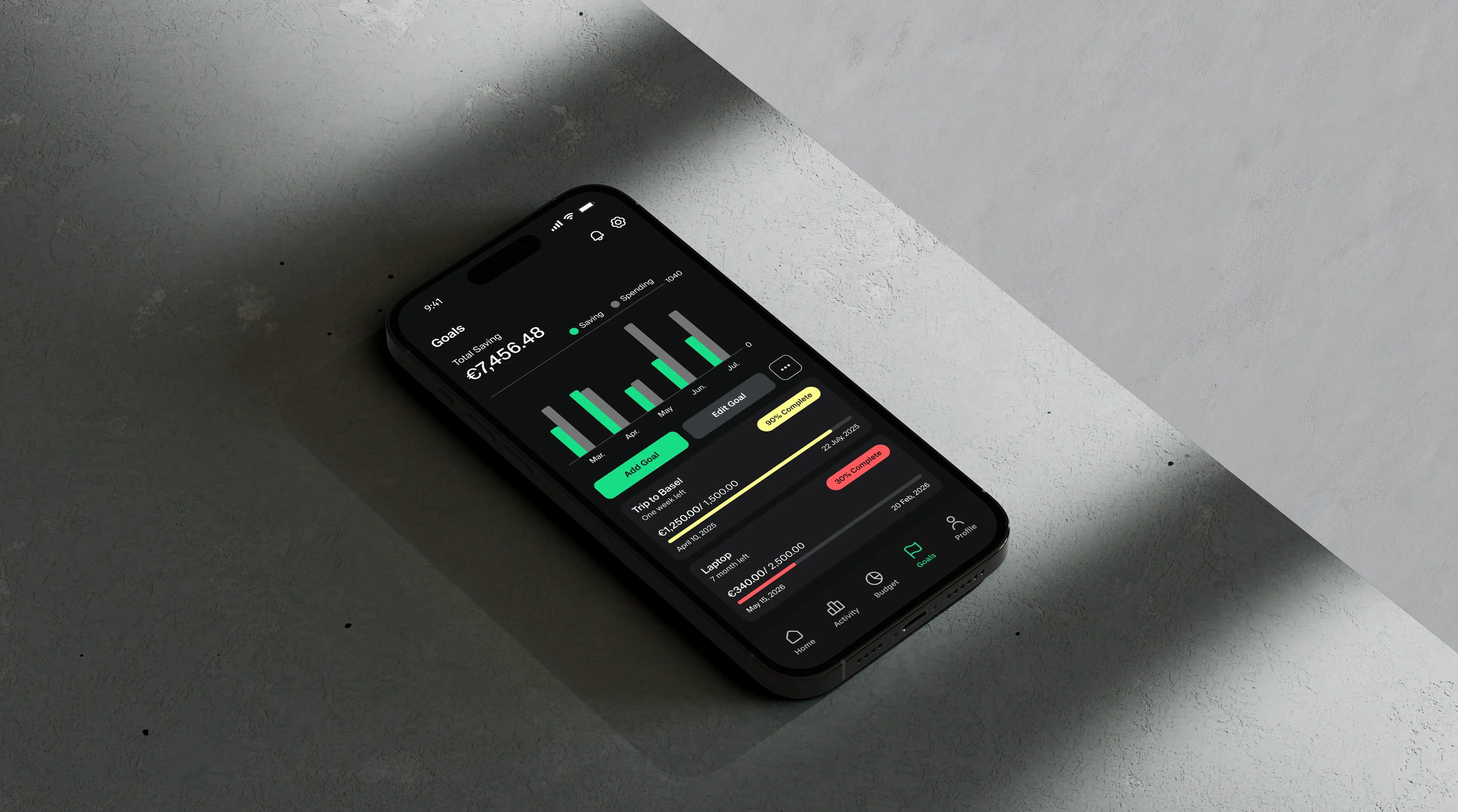 Grava Goals screen on a phone lying on a concrete surface
