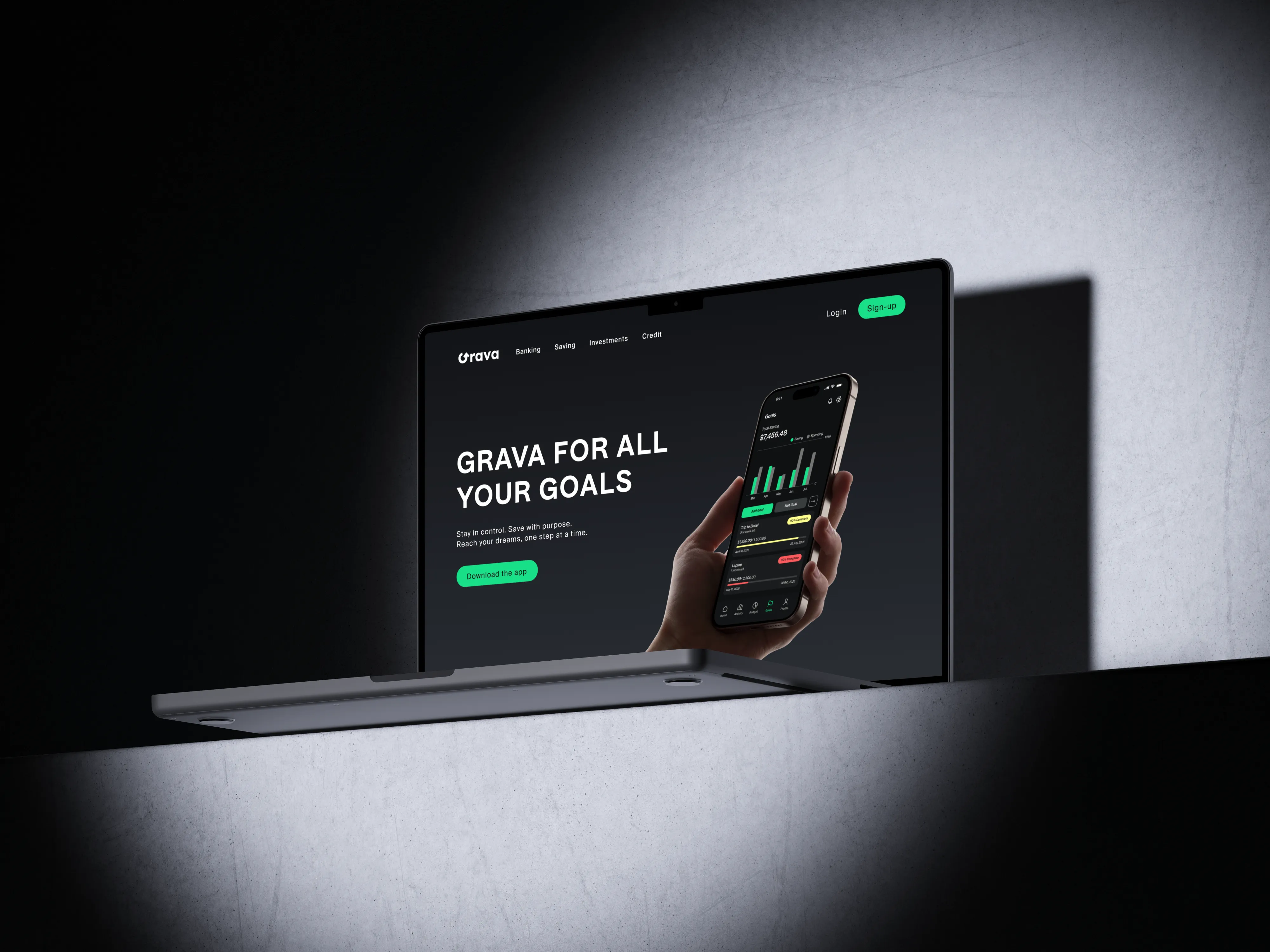 Grava marketing site on a laptop against a dark concrete wall